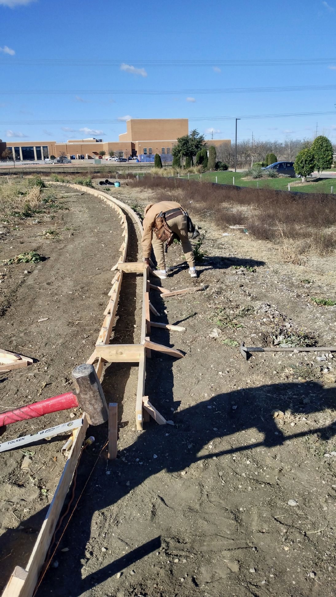 Concrete mow strip and foundation work for fence installation