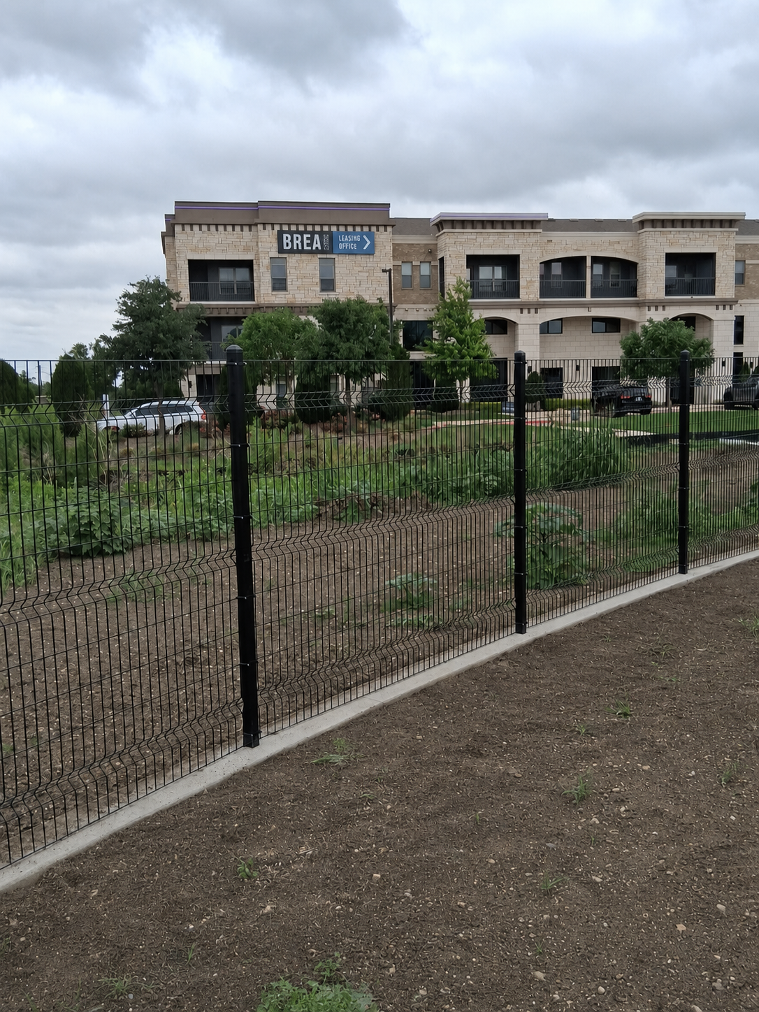 Ornamental iron fence installation